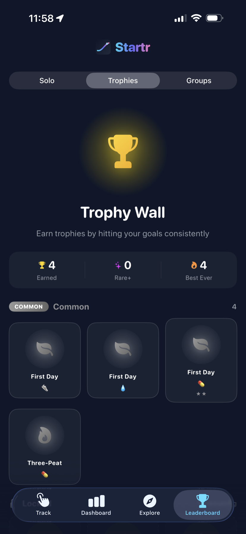 Startr Trophy Wall showing earned milestone trophies glowing in gold